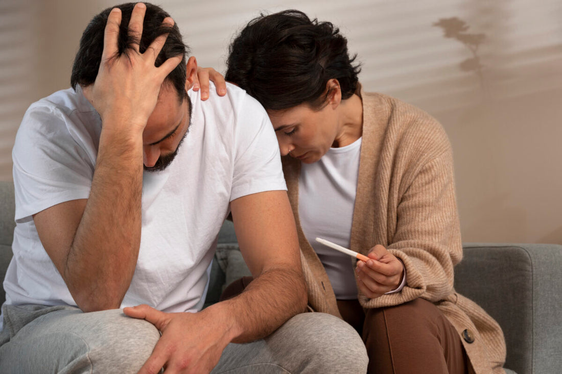 A Couple in tension due to infertility disease, a women holds a pregnancy strip